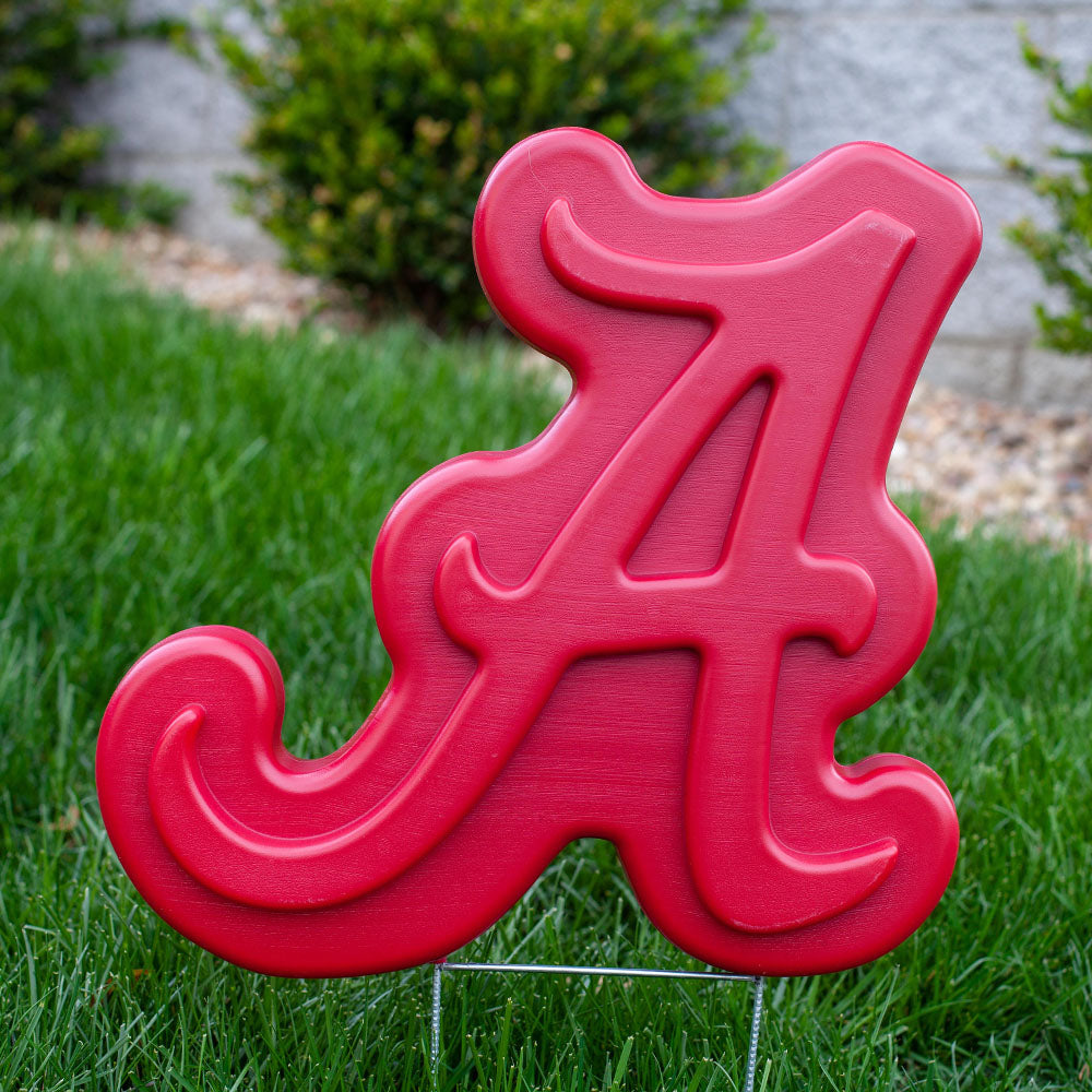 Alabama Crimson Tide Lawn Ornament - in lawn with green grass